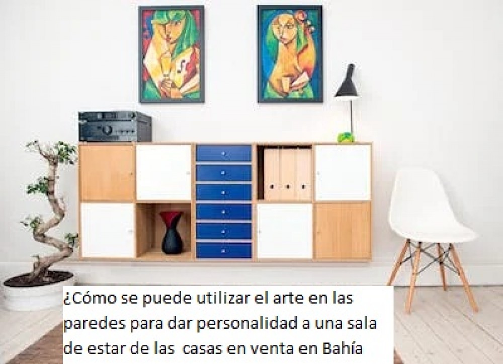 ¿Cómo se puede utilizar el arte en las paredes para dar personalidad a una sala de estar de las  casas en venta en Bahía Blanca?